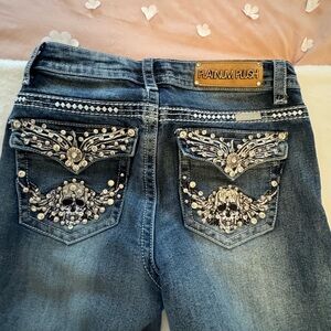 Platinum Plush jeans with rhinestone pockets. Size 7